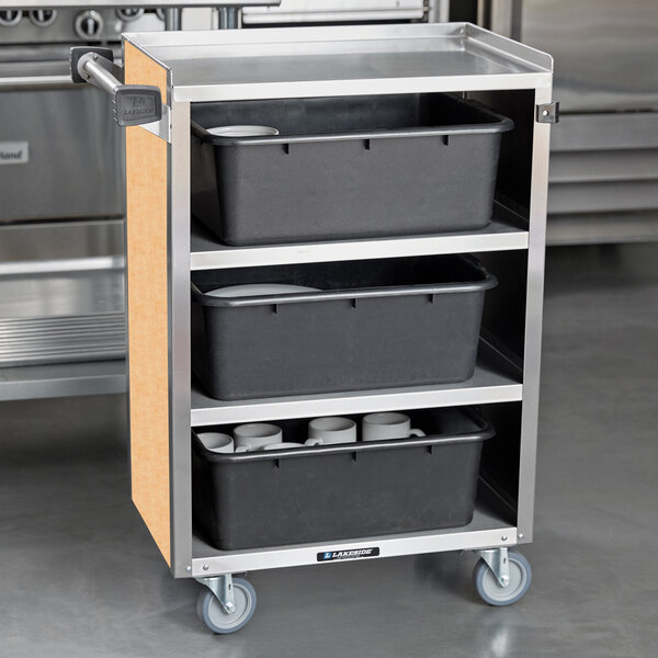 A Lakeside metal utility cart with black containers on the shelves.