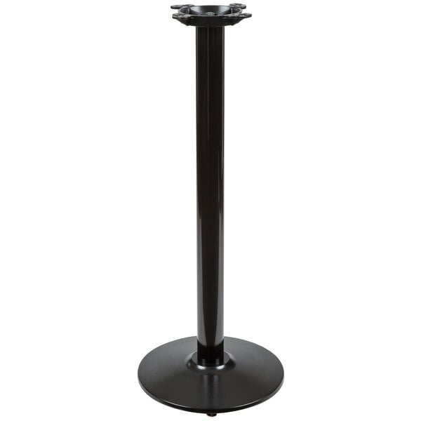 A Lancaster Table & Seating black cast iron bar height table base with a round base and cylinder shape.