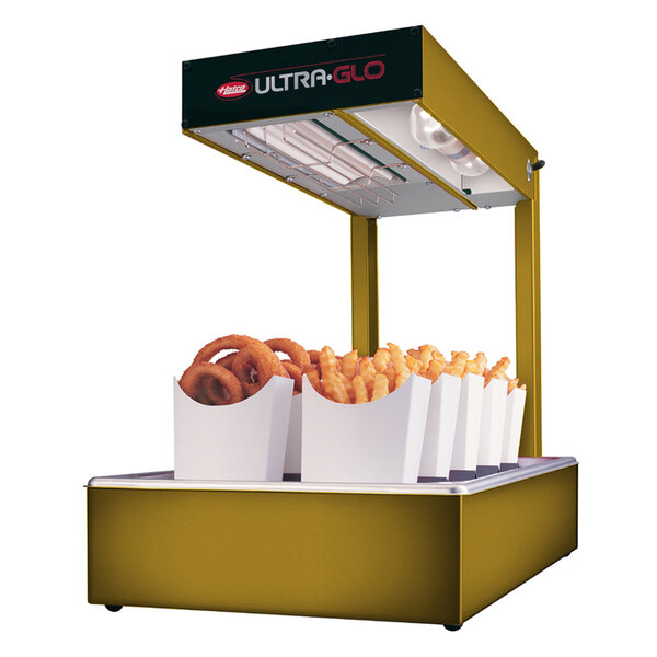 A Hatco Ultra-Glo food warmer with fries and hot dogs.