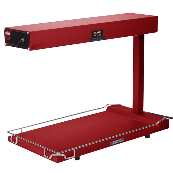 A red rectangular Hatco food warmer with a heated base.