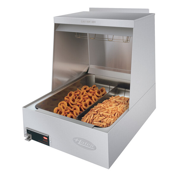 A Hatco portable fry holding station on a counter with food in it.