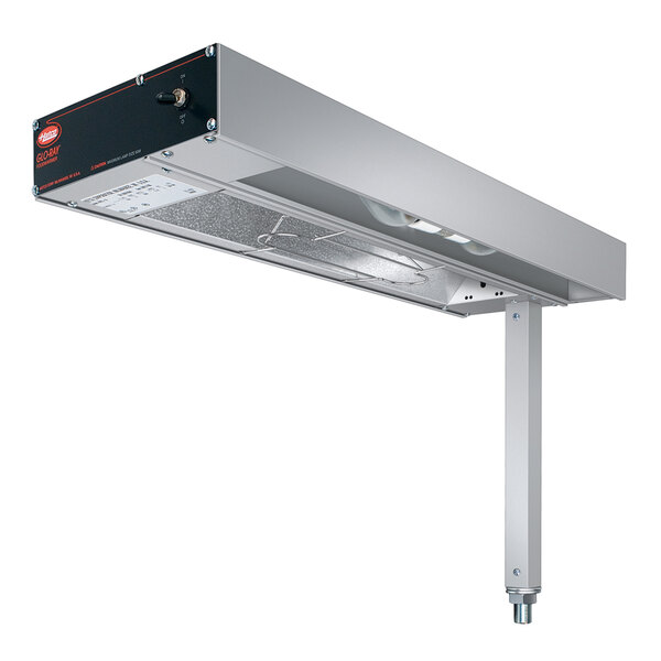 A Hatco fry station overhead warmer with metal elements and lights above a stainless steel shelf.