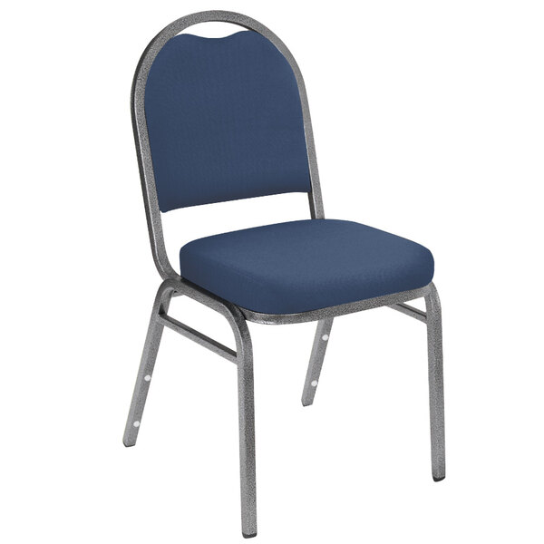 A National Public Seating silver metal frame stack chair with midnight blue vinyl upholstery.