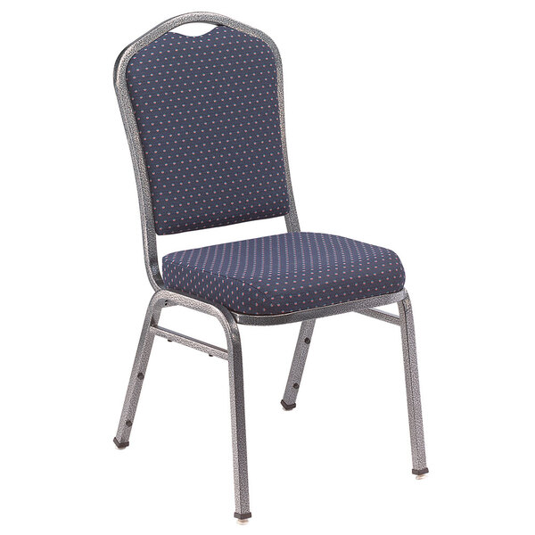 A silver metal banquet chair with a blue and white polka dot seat and back.