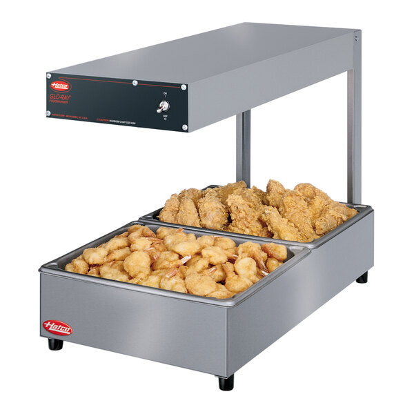 A Hatco Glo-Ray portable food warmer with two trays of food.