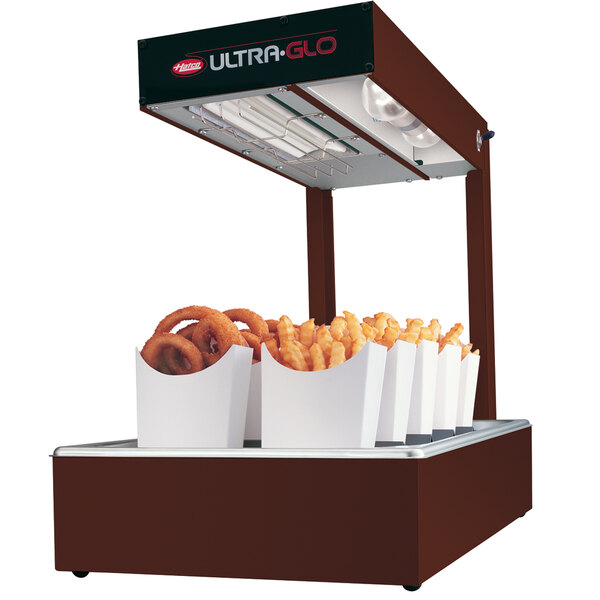A Hatco Ultra-Glo portable food warmer with french fries and onion rings in it.