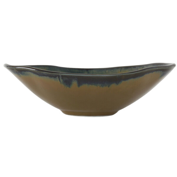 A close-up of a Tuxton Capistrano bowl with a brown and blue design on the inside.