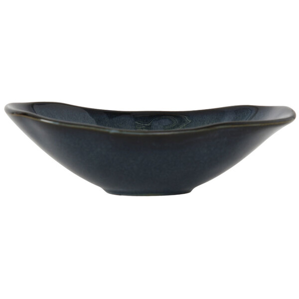 A Tuxton Capistrano bowl with a dark blue rim and a black base.