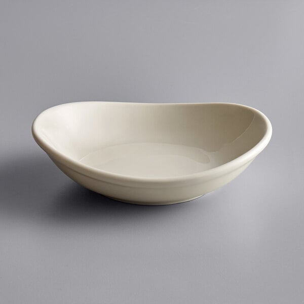 A Tuxton eggshell white china bowl.