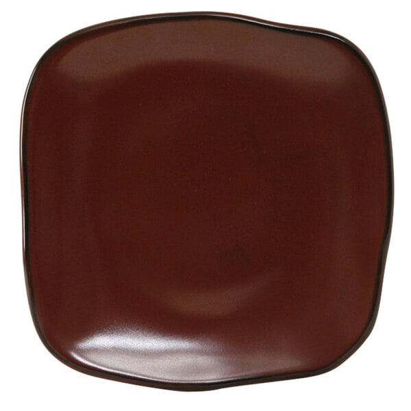 A brown square Tuxton Artisan china plate with a black rim.