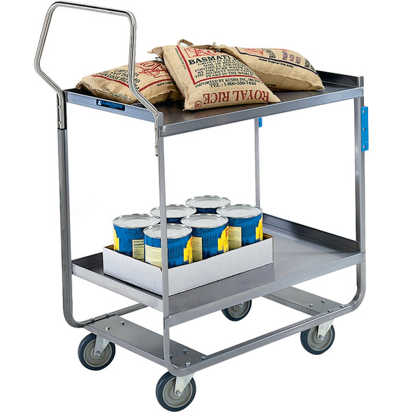 A Lakeside stainless steel utility cart with bags and blue containers on top.