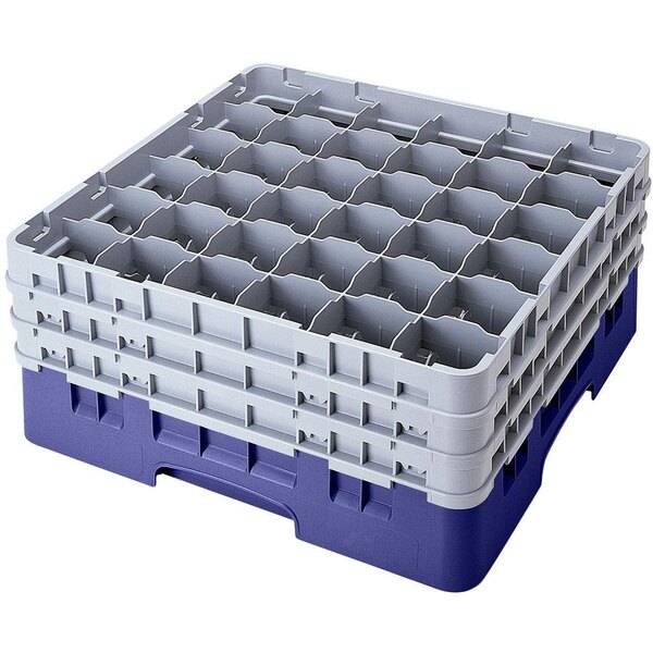 A navy blue plastic Cambro glass rack with 36 compartments and 4 extenders.