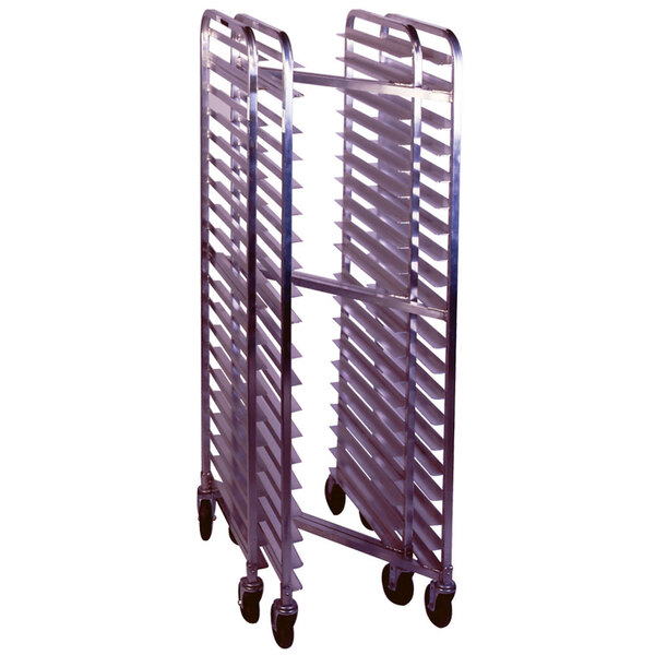 A Winholt stainless steel sheet pan rack with wheels holding several sheet pans.