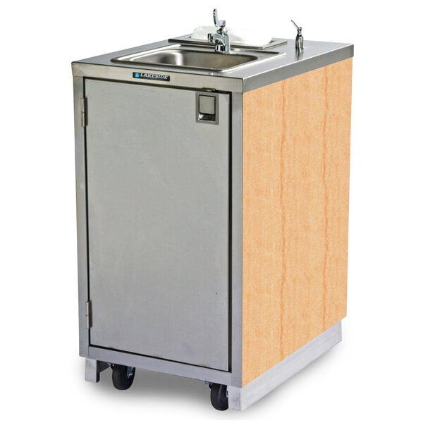 A stainless steel sink and wooden cabinet on wheels.