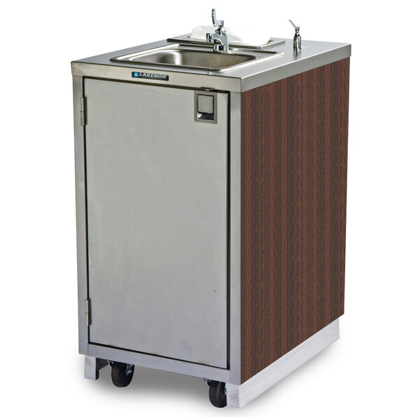 A stainless steel sink and a wooden cabinet on a Lakeside portable sink cart.