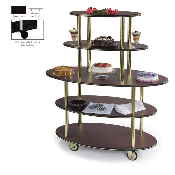 A Geneva oval serving cart with three shelves holding desserts.
