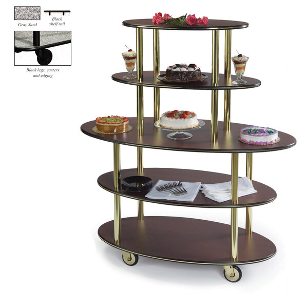 A Geneva oval shelf dessert cart with a glass top holding cakes.