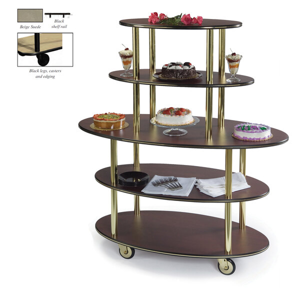 A beige oval dessert cart with three shelves holding cakes.