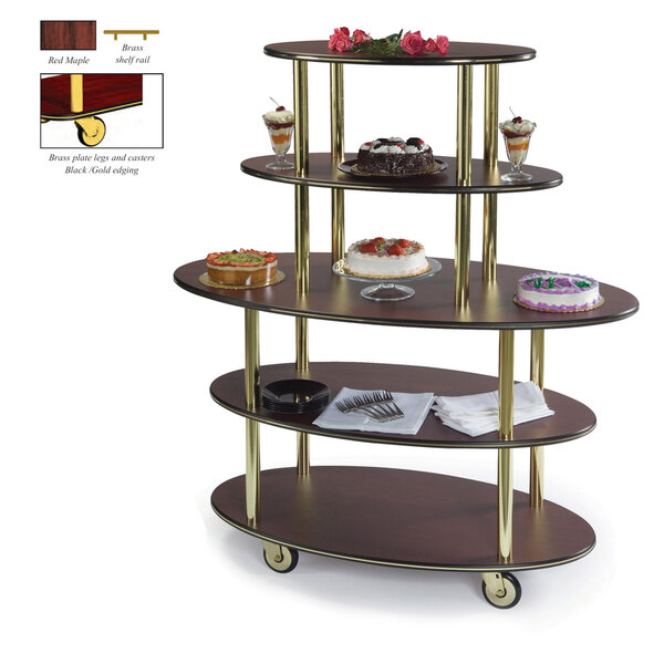 A Geneva oval serving cart with red maple shelves holding desserts.