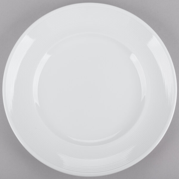 An Arcoroc Rondo brunch plate with a white border on a white background.