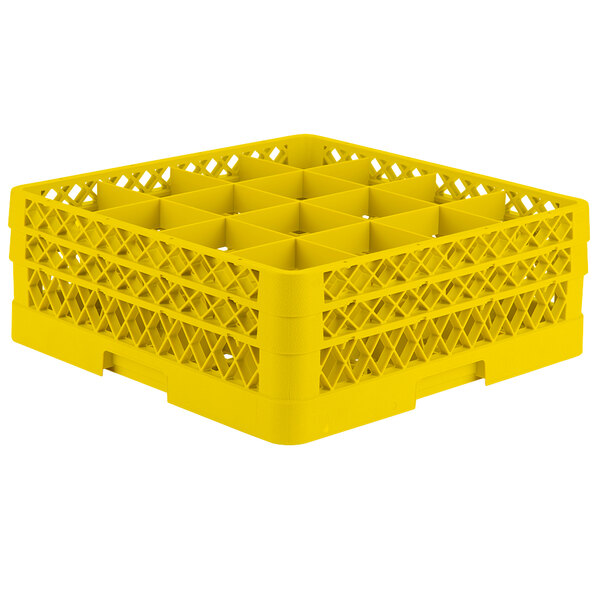 A yellow Vollrath Traex glass rack with 16 compartments.