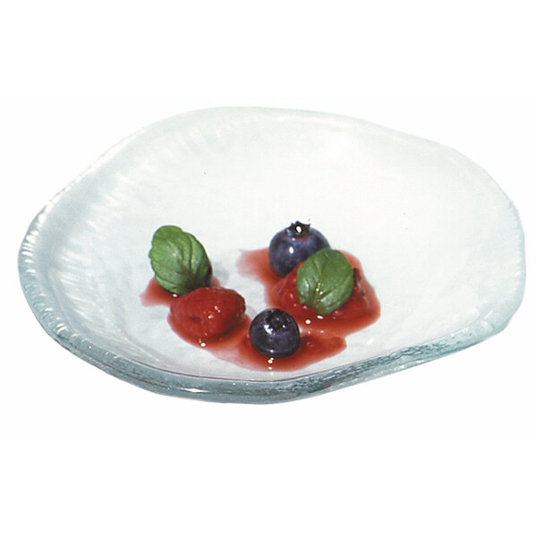 A white 10 Strawberry Street Opal Glass bowl with blueberries, strawberries, and leaves.
