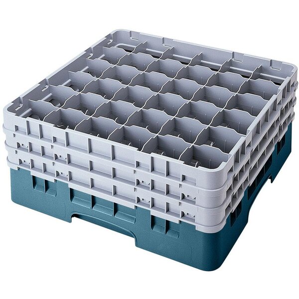 A teal plastic Cambro glass rack with 36 compartments and 2 extenders.