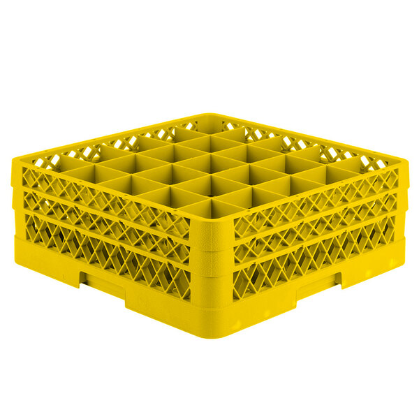 A yellow Vollrath plastic rack with 25 compartments.