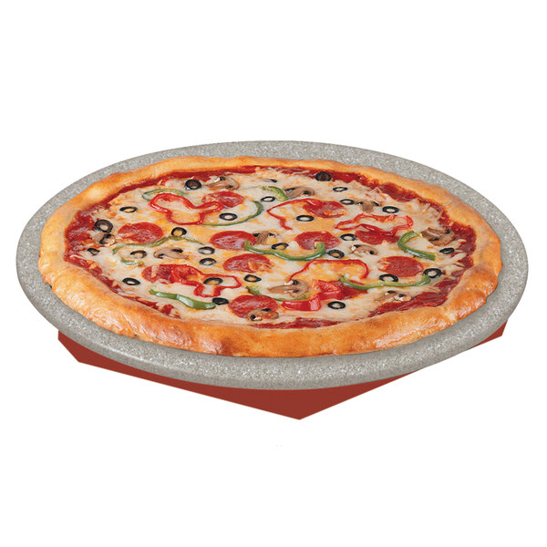 A pizza on a Hatco heated stone shelf.