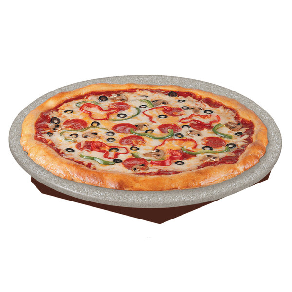 A pizza on a Hatco heated stone shelf with a copper finish.