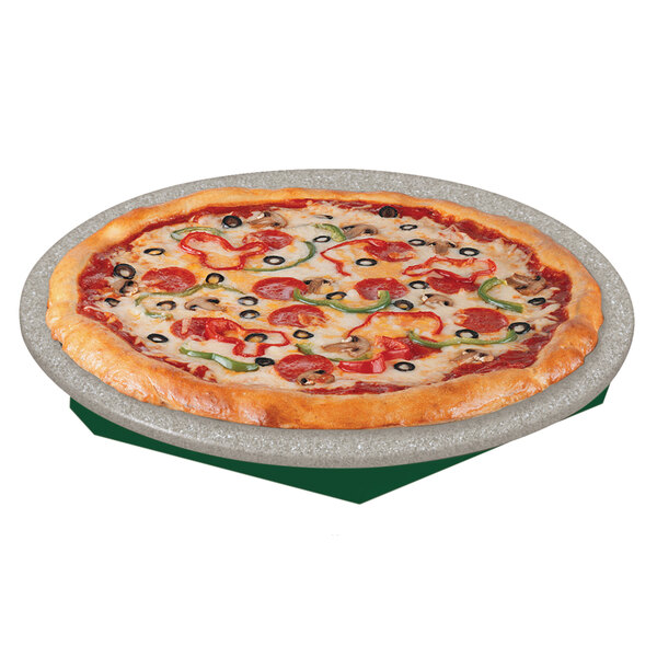 A pizza on a green Hatco heated stone shelf with a lid.