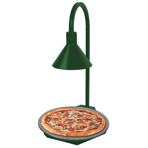 A green and gray granite heated stone shelf with a pizza on a plate being warmed by a display lamp.