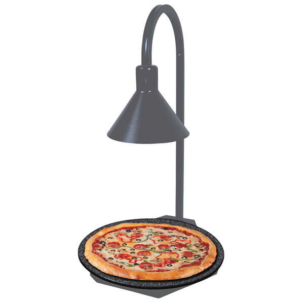 A Hatco heated stone shelf with a pizza and a display lamp on a table.