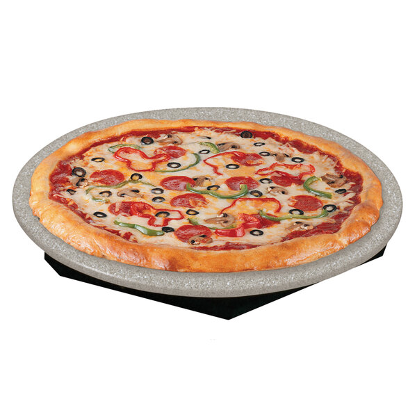 A pizza on a Hatco heated stone shelf with a black base.