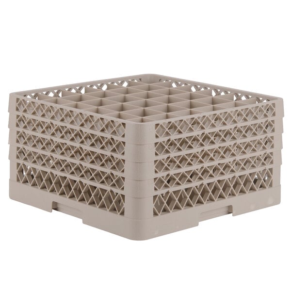 A beige plastic Vollrath Traex glass rack with a grid pattern and many compartments.