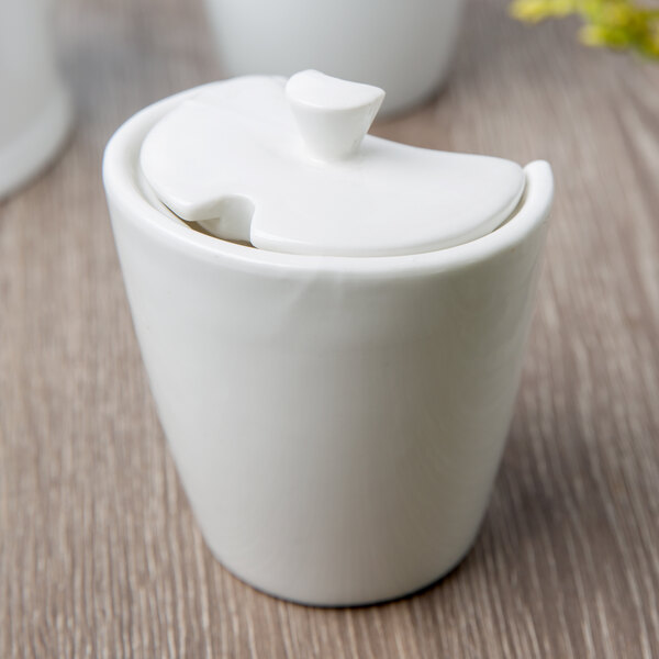 A white porcelain 10 Strawberry Street sugar bowl with a lid.
