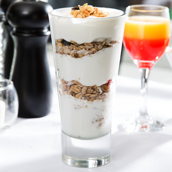 A Libbey beverage glass filled with yogurt and granola.