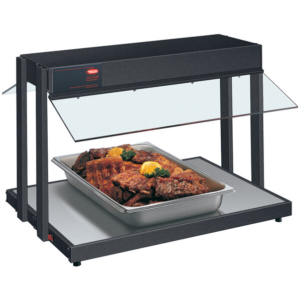 A Hatco countertop buffet warmer with a tray of meat.