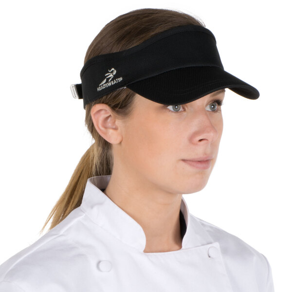 A woman wearing a black Headsweats visor.