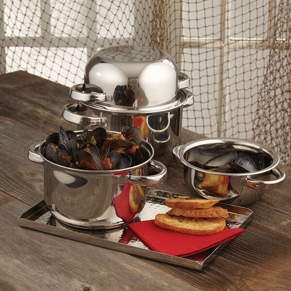 An American Metalcraft stainless steel bowl with mussels and a lid on a tray.