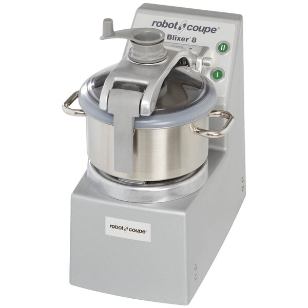 A Robot Coupe stainless steel batch bowl food processor with a lid on it.