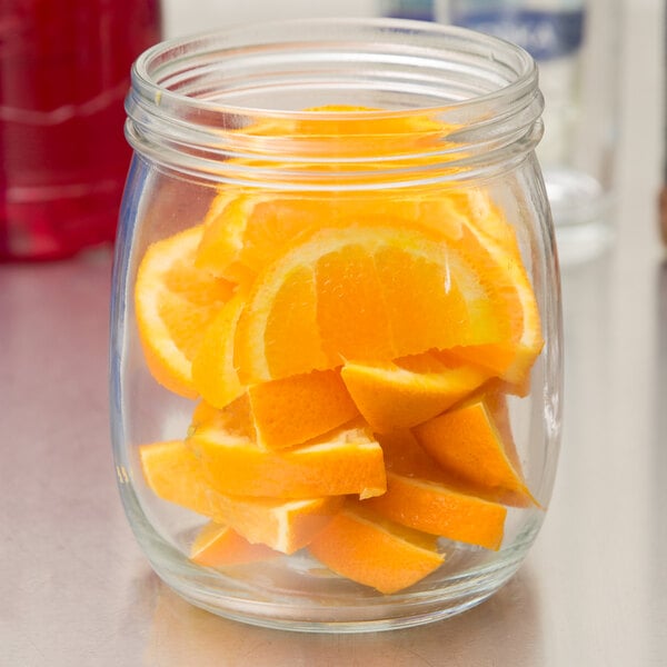 An American Metalcraft mason jar filled with sliced oranges.