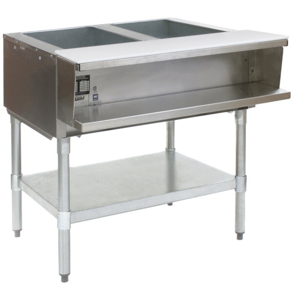 A stainless steel Eagle Group commercial water bath steam table with two pans on a counter.