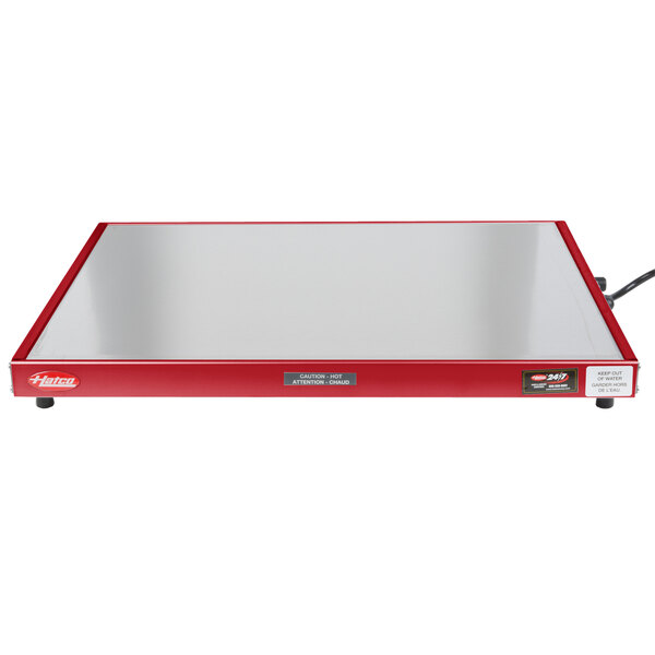 A red rectangular Hatco heated shelf with a white wire.