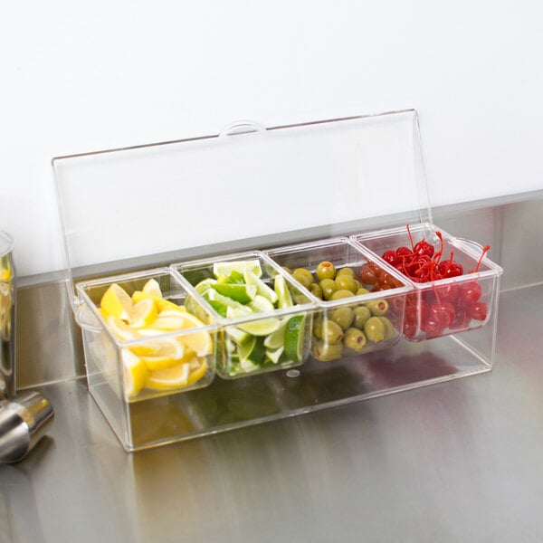 An American Metalcraft 4-compartment condiment bar with clear plastic containers of fruit.