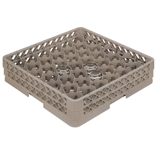 A beige Vollrath Traex glass rack with 42 compartments and holes.