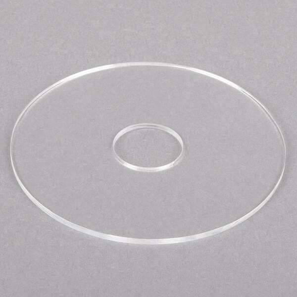 A clear plastic circle with a hole in the middle.
