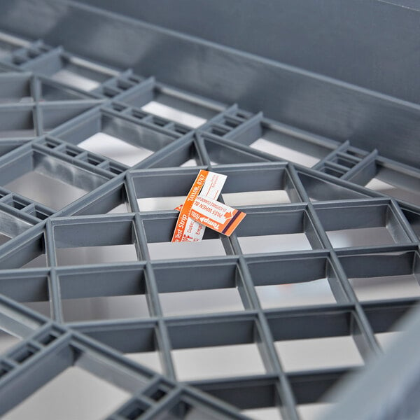 A grey plastic tray with small pieces of paper with the label "Taylor 8767J TempRite Single Use Dishwasher 180 Degrees F Test Strip"