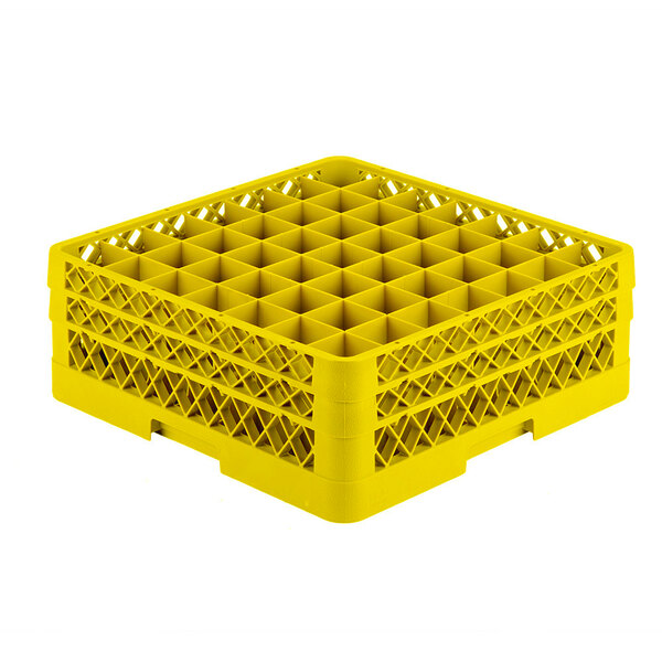 A yellow Vollrath Traex glass rack with many small compartments.
