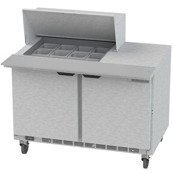 A Beverage-Air commercial refrigerated sandwich prep table with two doors open on a counter.